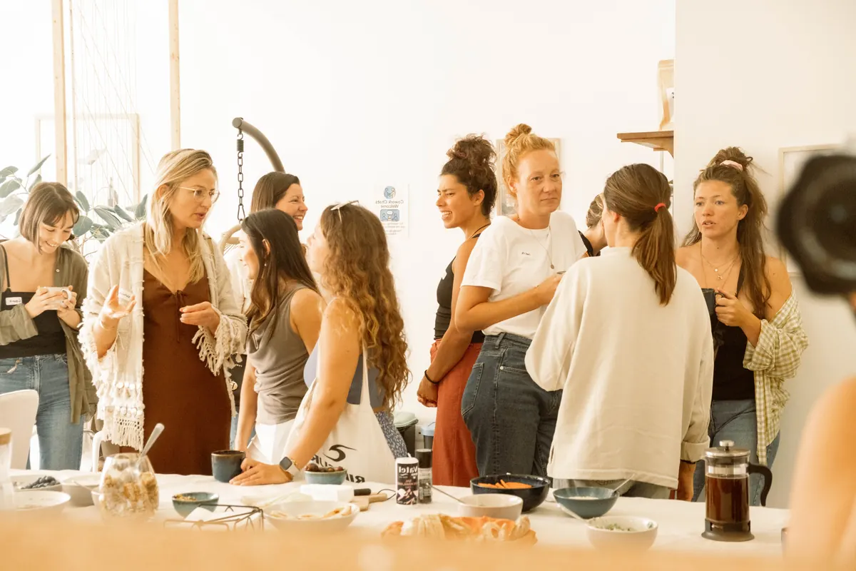 Guests standing and talking at a morning gathering