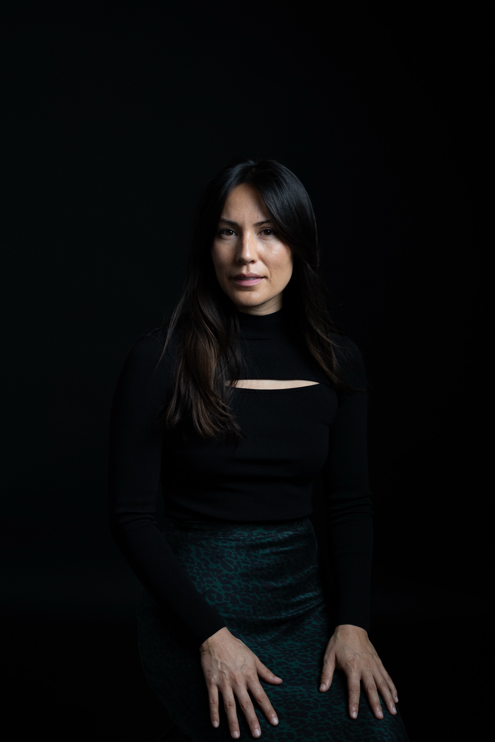 Portrait of Jennifer Nunez against a dark background